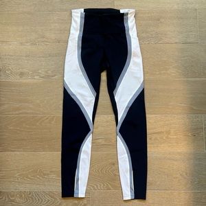 Lululemon leggings with reflective strips at the calf. Size 4.